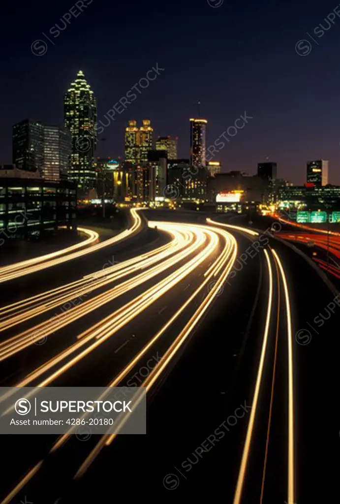 expressway, Atlanta, GA, skyline, Georgia, Traffic lights streak on I-75/I-85 at sunset and view of the skyline of downtown Atlanta.