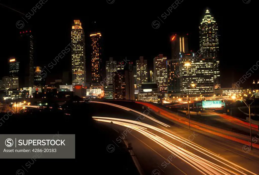 Atlanta, GA, skyline, Georgia, Traffic lights streak on Freedom Parkway in the evening and skyline of downtown Atlanta.