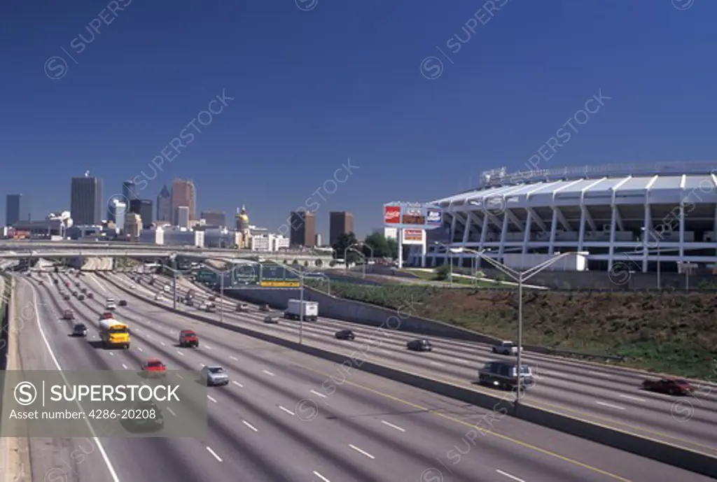expressway, Atlanta, skyline, GA, Georgia, Skyline of Atlanta and Fulton County Stadium. Traffic on interstate I-85/75 in Atlanta.