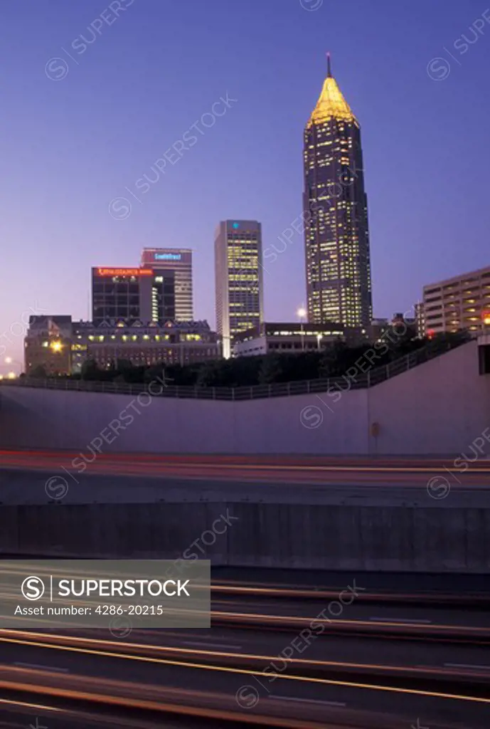 Atlanta, skyline, GA, Georgia, Skyline of downtown Atlanta and streaks of car lights on Downtown Connector I-75/85 in the evening.