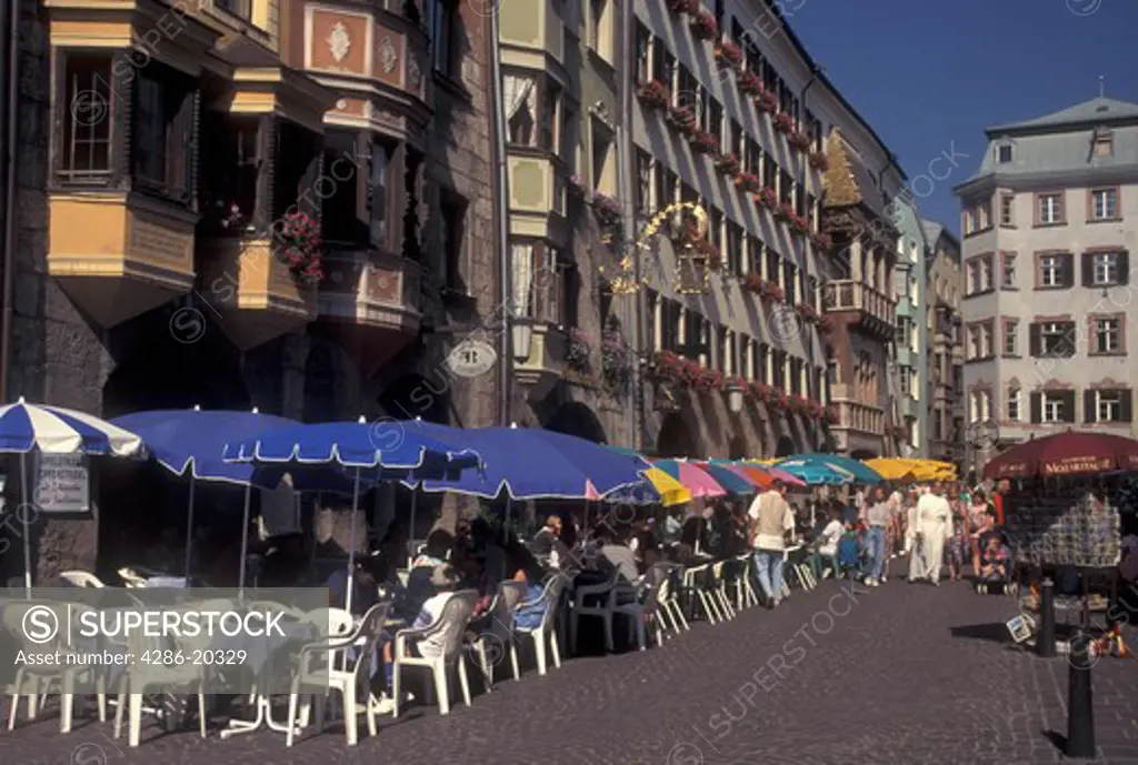 outdoor caf, Austria, Innsbruck, Tirol, Outdoor cafes along a cobbled pedestrian street in the city of Innsbruck.