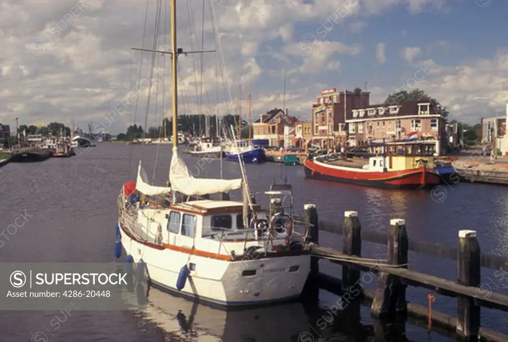 Netherlands, Holland, Groningen, Delfzijl, North Sea, Europe, Boats docked along the harbor of Delfzijl on the North Sea.