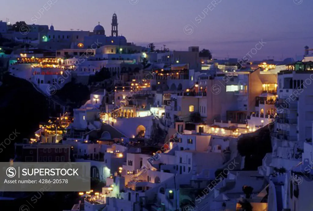Greece, Santorini, Greek Islands, Fira, Cyclades, Europe, Village of Fira at night on the steep hillside of Santorini Island on the Aegean Sea.