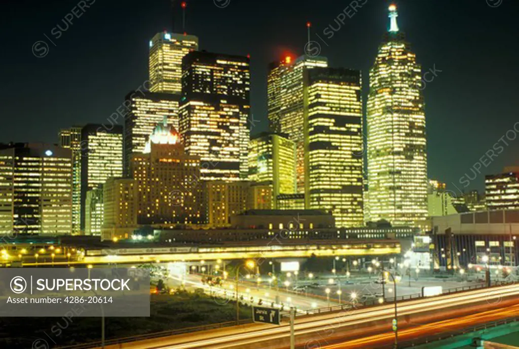 Toronto, Canada, Ontario, Skyline of downtown Toronto along Gardiner expressway in the evening. 