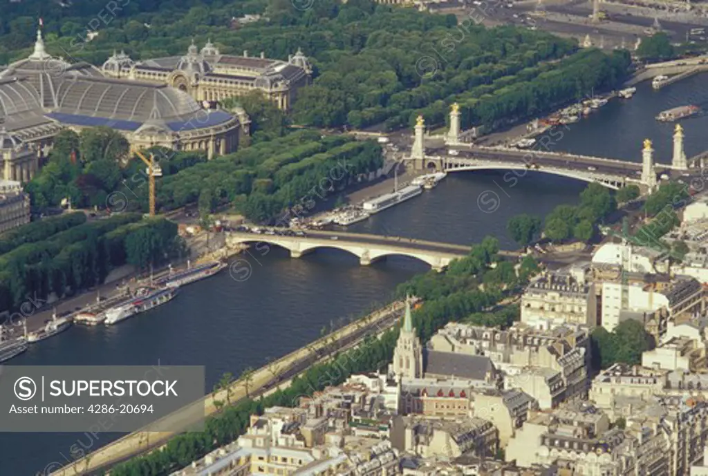 France, Paris, Ile de France, France, Aerial view of the city of Paris and the Grand Palais along the Seine River looking Northeast from the Eiffel Tower.