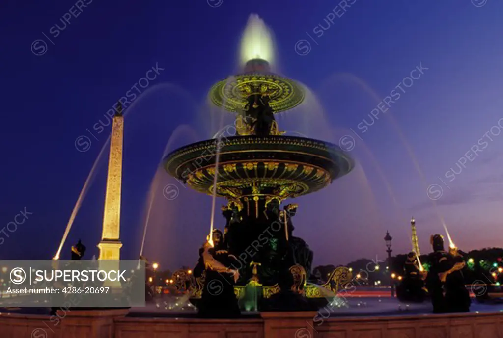 Paris, Ile de France, fountain, France, Europe, The Obelisque and fountain at Place de la Concorde in the city of Paris in the evening.