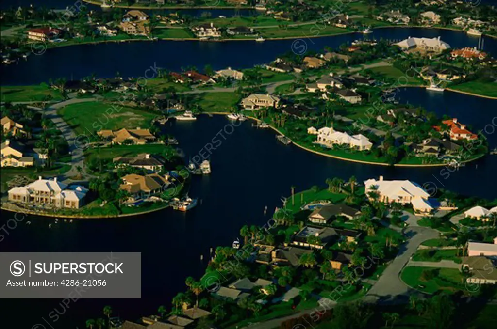 Aerial view of large homes on an inlet golf course in Vero Beach, Florida.