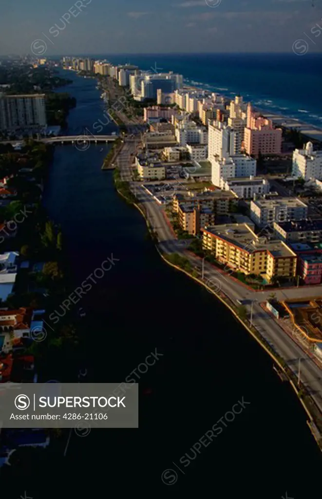 Aerial view of Miami Beach, Florida with the Intercoastal Waterway and Atlantic Ocean in view.