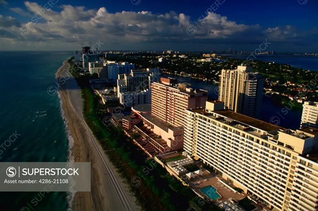 Aerial view of Miami Beach, Florida in early morning sunshine with the Atlantic Oean and Intercoastal Waterway in view.