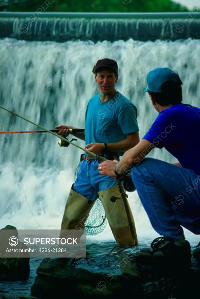 Two males fish at waterfalls. Yellow Breeches, New Cumberland, PA.MR