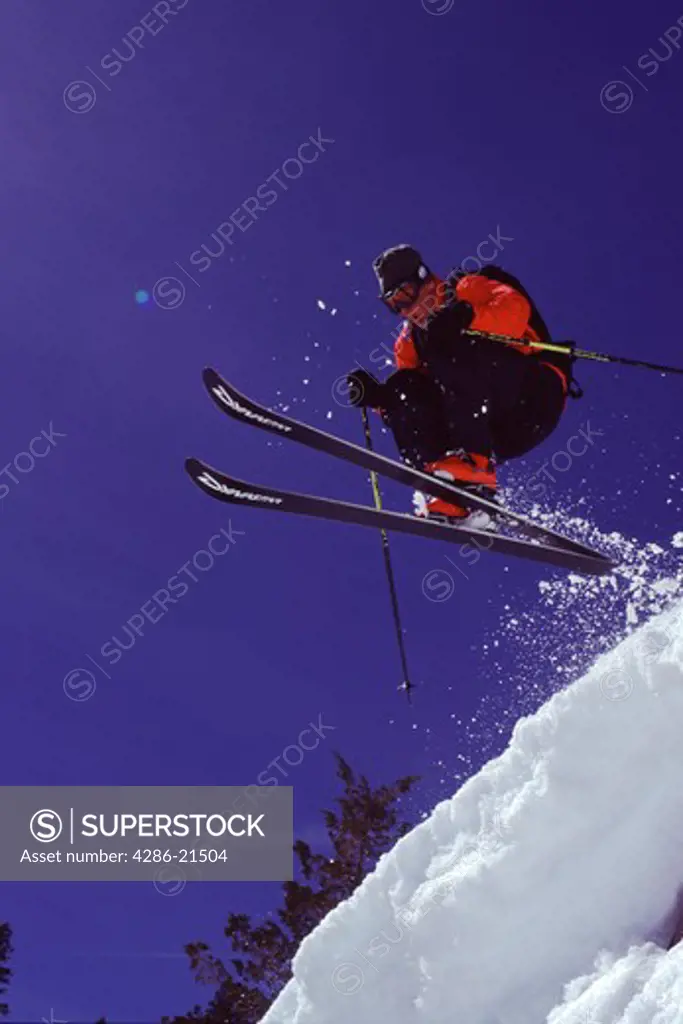 A man jumping while telemark skiing on Donner Summit, CA.
