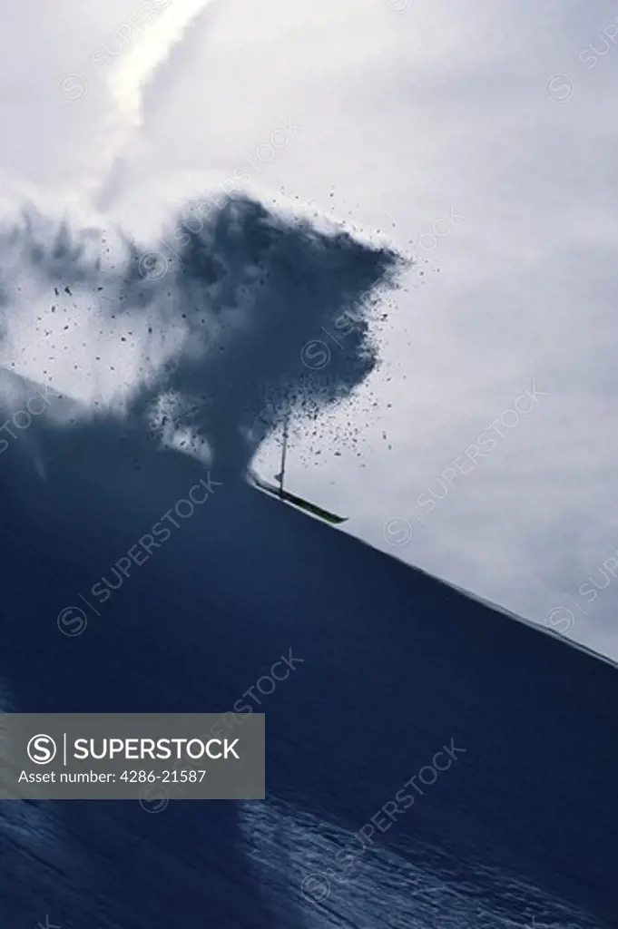 A man skiing powder at Snowbird, UT.