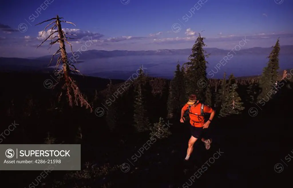 A man running above Lake Tahoe, CA.