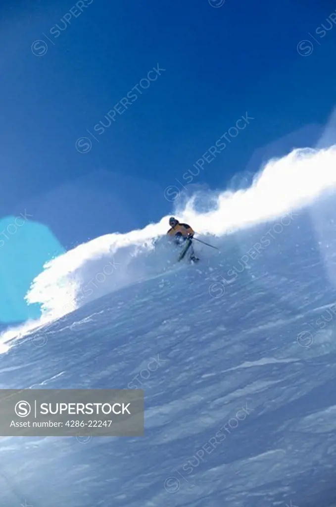 A man skiing powder at Sugar Bowl, CA.