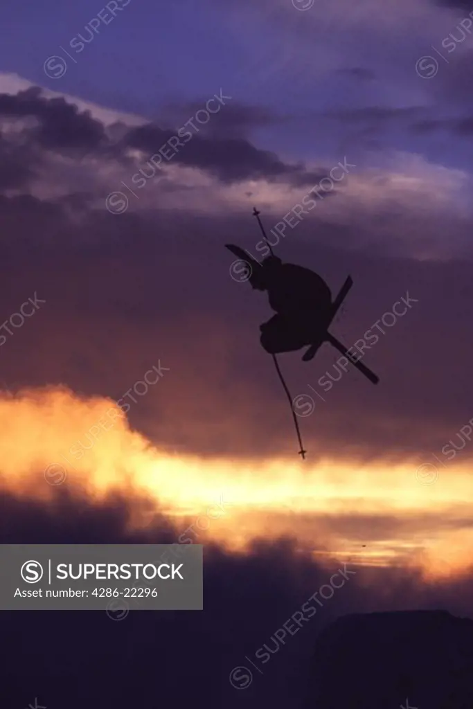 A man jumping on skis at Mount Hood, OR.