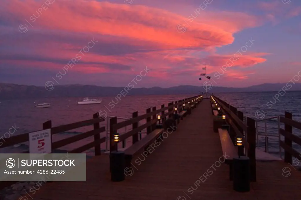 Pink Clouds Over Lake Tahoe With a Boat Dock