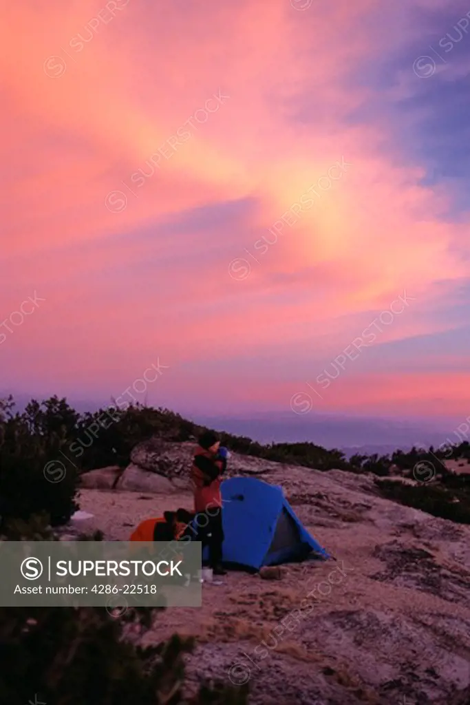 Two Women Camping at Sunset in Yosemite National Park, CA,