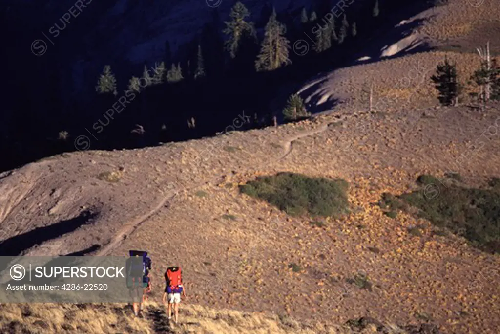 A father and daughter hiking in the Sierra Mountains in California