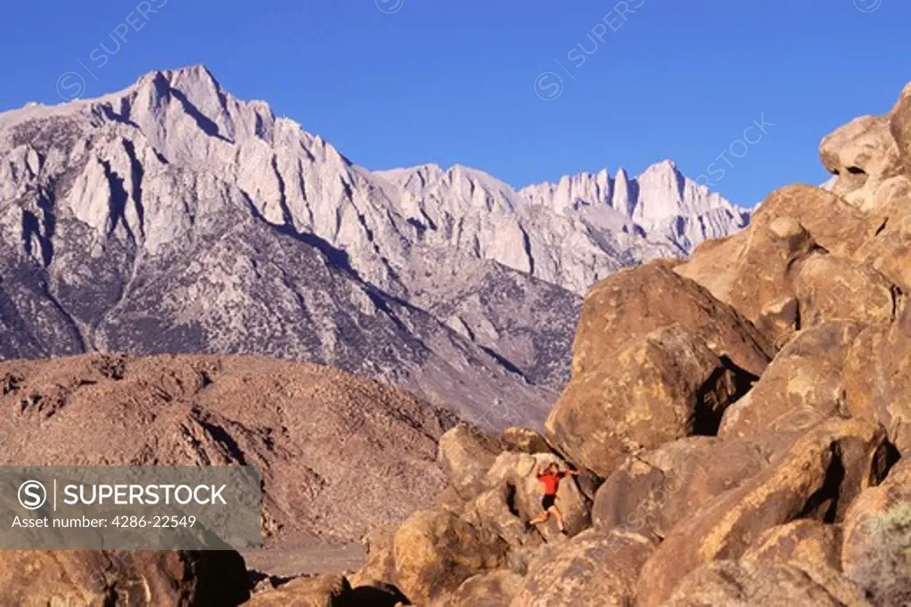 A woman jumping in the Alabama Hills near Mount Whitney in California.