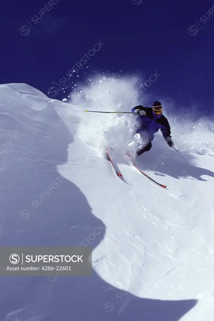 A man skiing powder snow at Squaw Valley in California.
