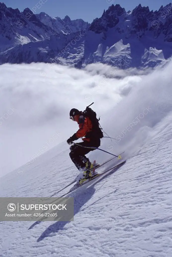 A man skiing powder snow in Chamonix, France.
