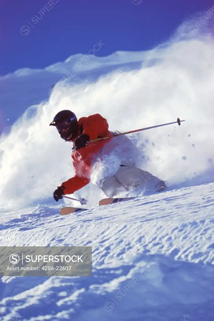 A man skiing powder snow in the Chugach mountains of Alaska.