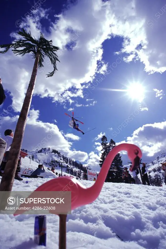A man jumping on skis at Squaw Valley in California.