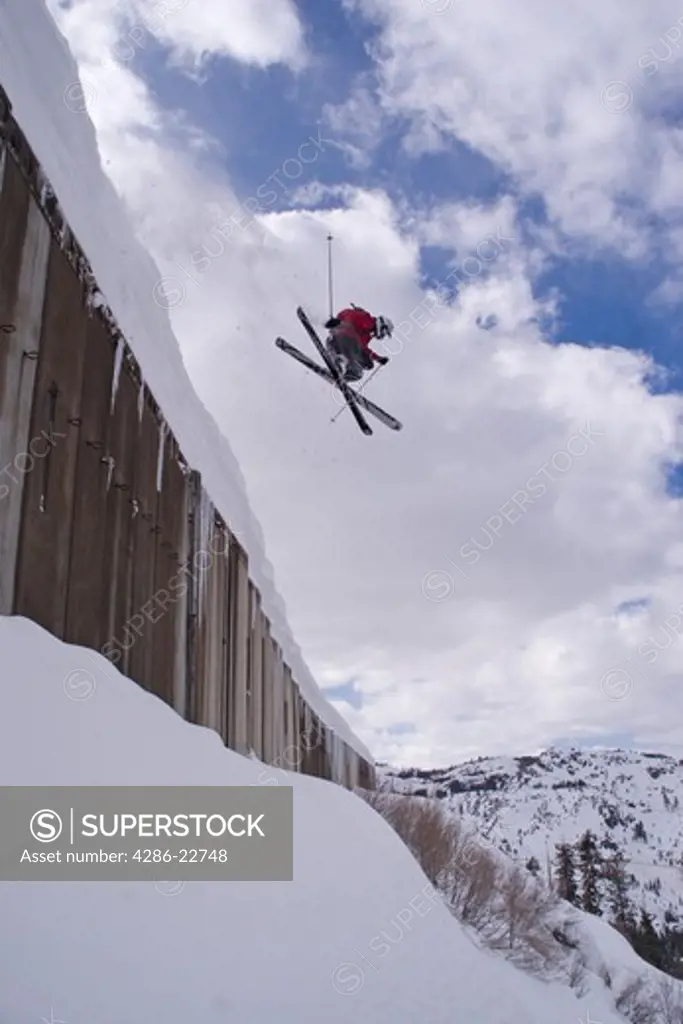 A man skiing off a train shed above Donner Lake California