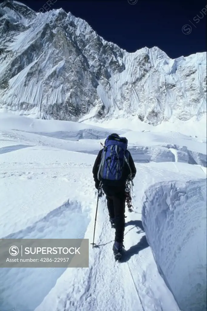 Crossing a crevasse on Mount Everest in the Khumbu Icefall