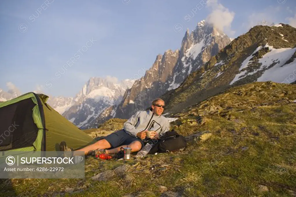 A man camping in the French Alps near Chamonix France.