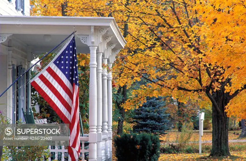USA Vermont Manchester US flag on porch in Autumn