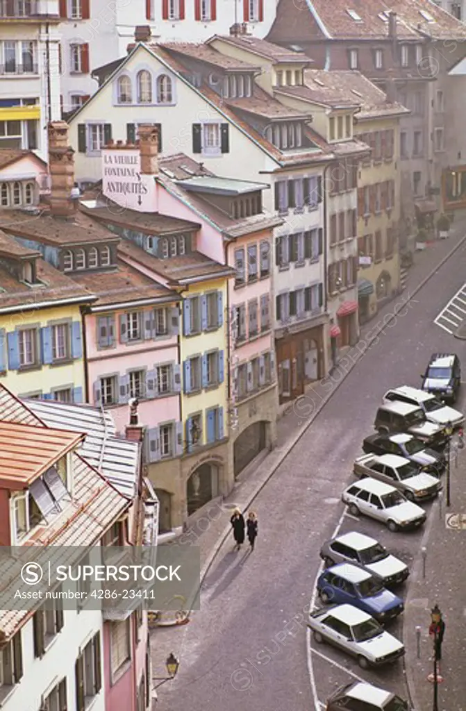 Switzerland Lausanne Two women walking down a street 
