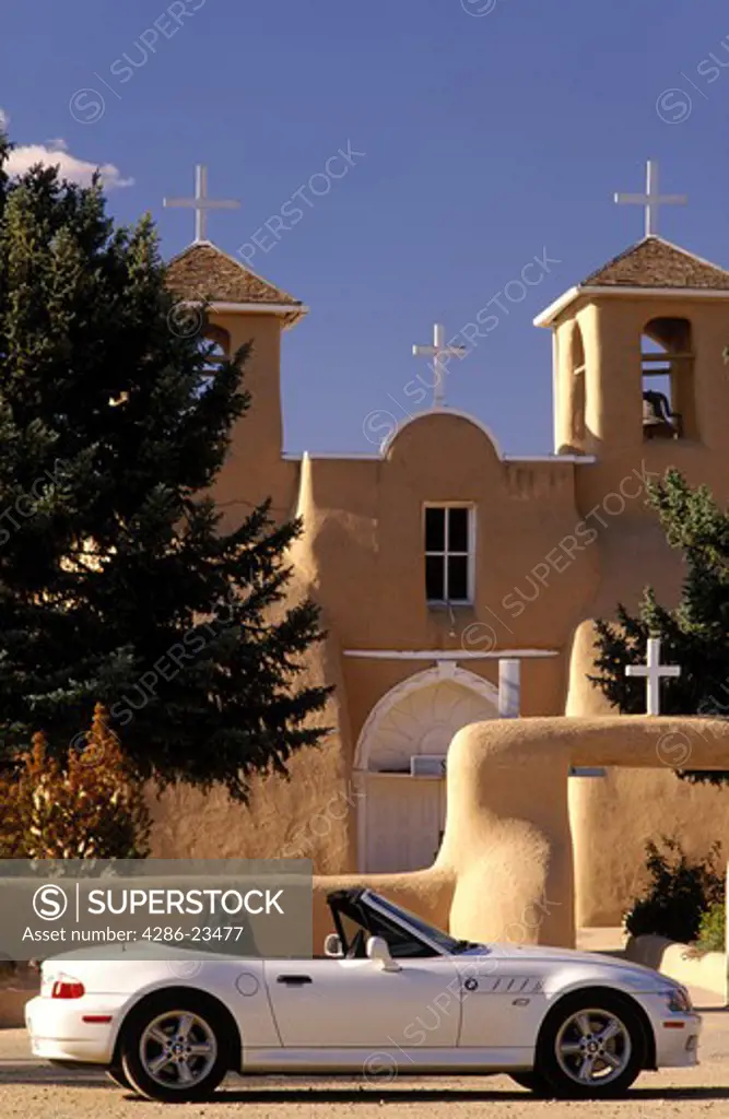 USA New Mexico Rancho de Taos Sports car BMW Z3 parked in front of Church of San Francis of Assisi established 1730