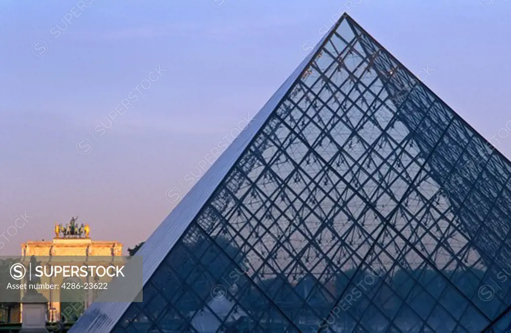 France Paris The Louvre Pyramid by I M Pei and the Arc de Triumphe de Carousal