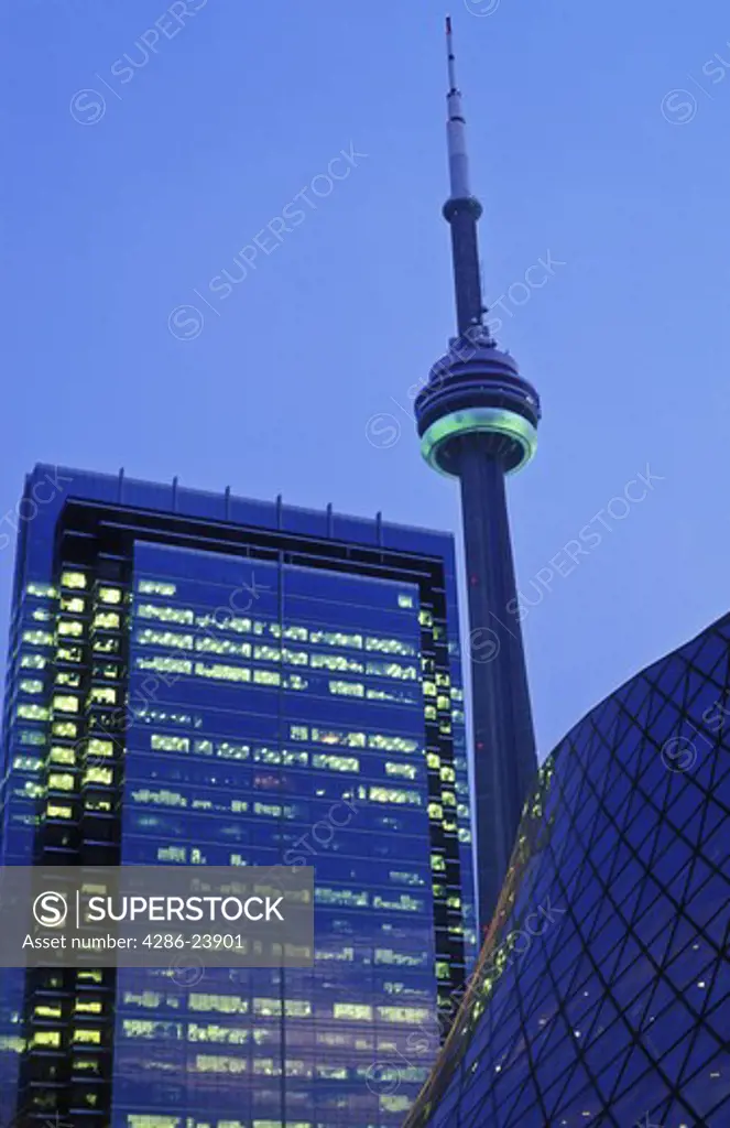 Canada, Ontario, Toronto, CN Tower and office building illuminated at dusk