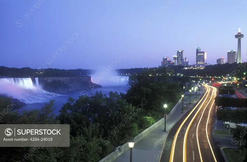 Canada, Ontario, Niagara Falls, view of the American and Canadian Falls at dusk. car traffic time exposure