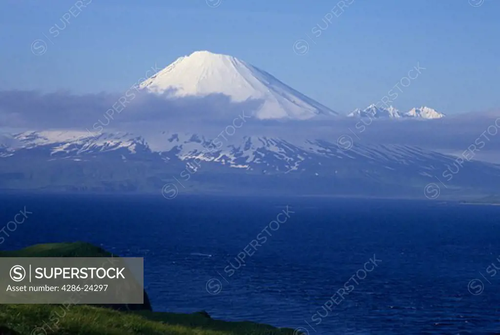 USA, Alaska, Aleutian Islands, Umnak Island, Bering Sea, Vsevidof Volcanic cone mountain from Anangula Island
