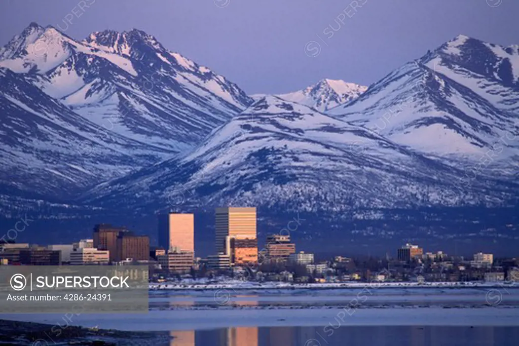 USA, Alaska, Anchorage from MacKenzie Point, Cook Inlet at sunrise, Chugach Mountains early spring