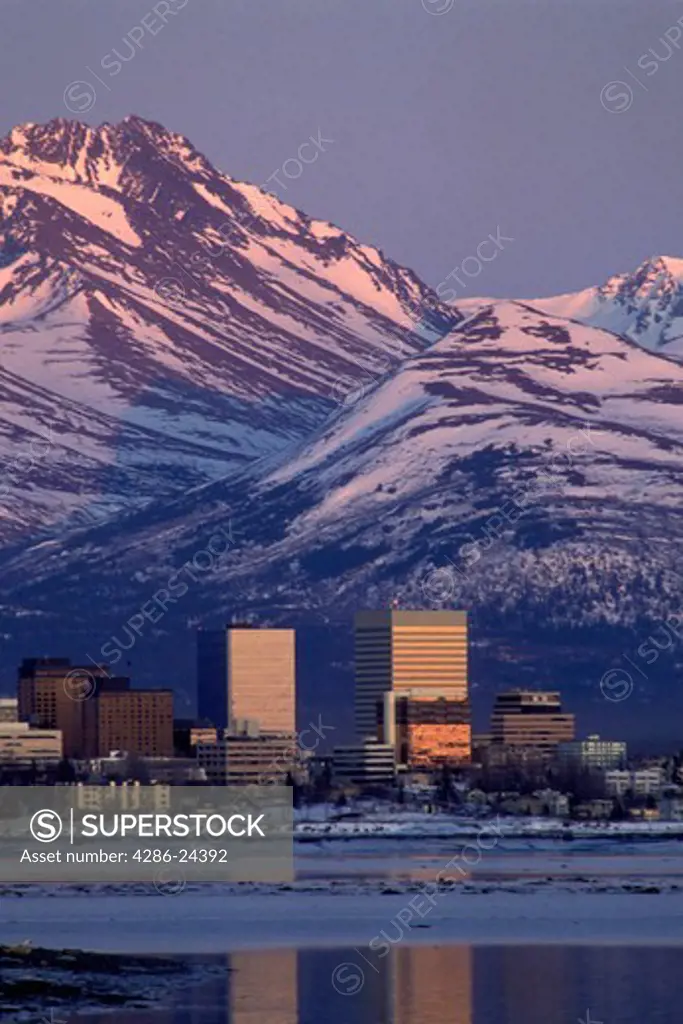 USA, Alaska, Anchorage from MacKenzie Point, Cook Inlet at sunrise, Chugach Mountains early spring, vertical image