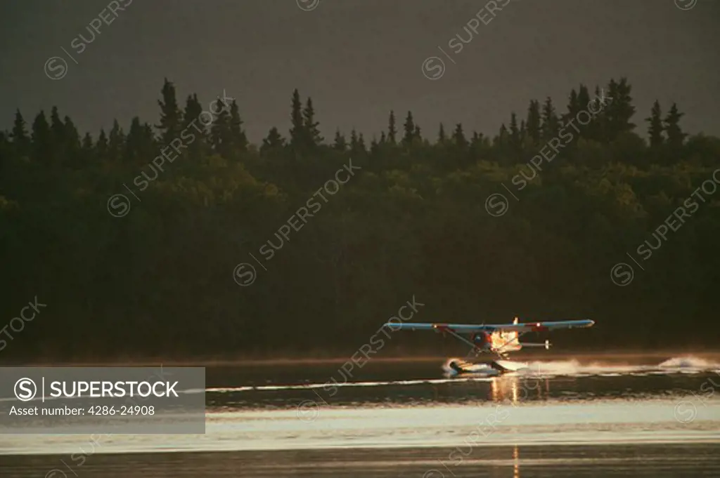Radial engine floatplane landing on Naknek Lake, Katmai National Park, Alaska.