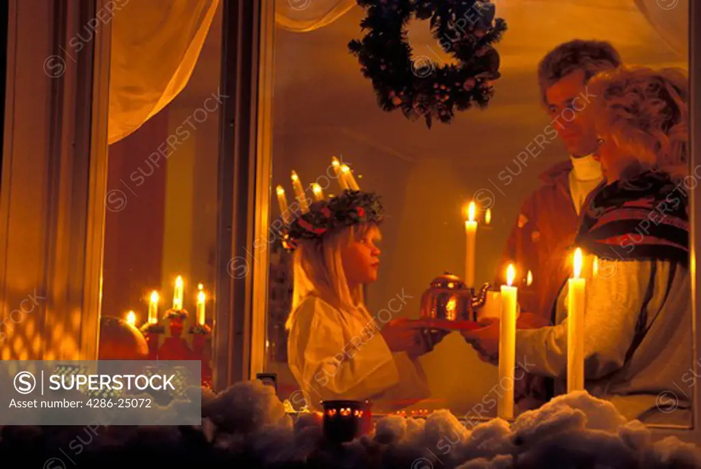 December 13th in Sweden is Saint Lucia Day when daughters wearing coronets of candles offer morning coffee and buns to parents 