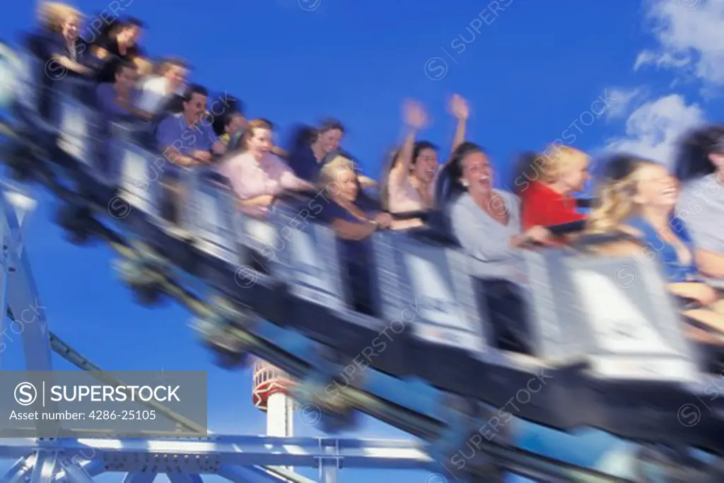 Roller coaster filled with screaming people