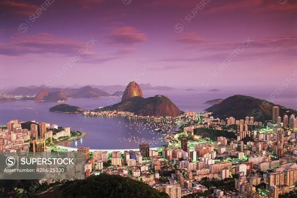 Above Sugar Loaf and Botofago Bay in Rio De Janeiro at sunset 