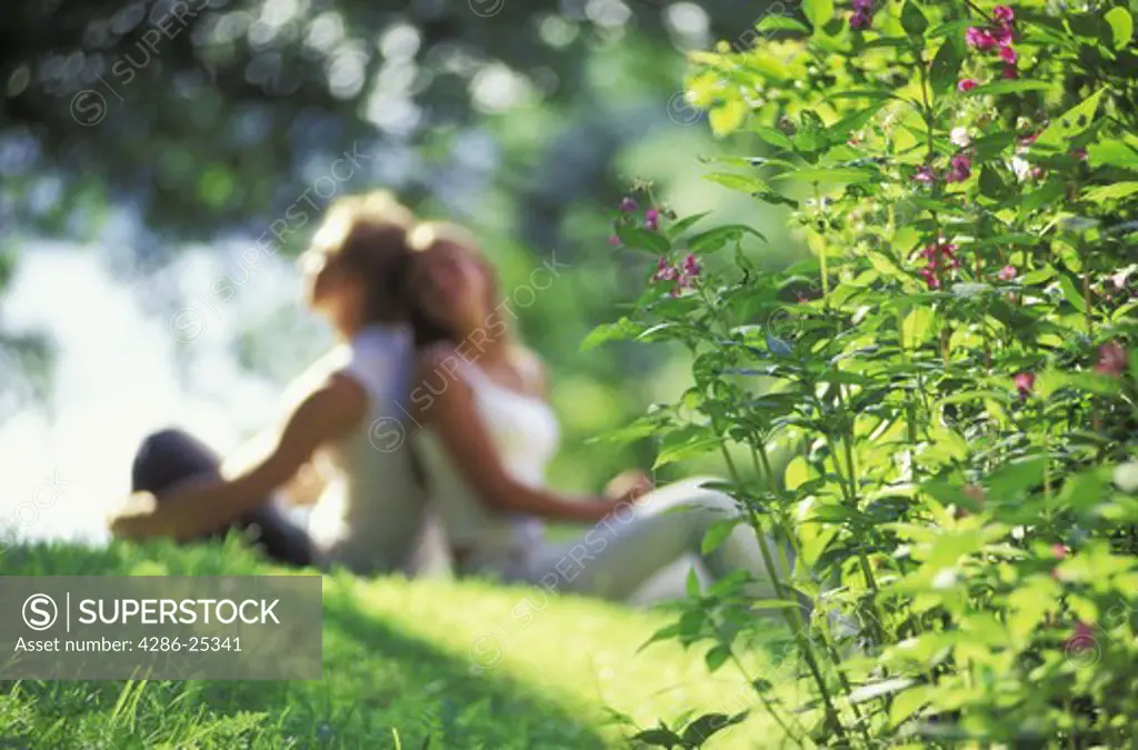 Couple sharing romantic summer moments like splendor on the grass