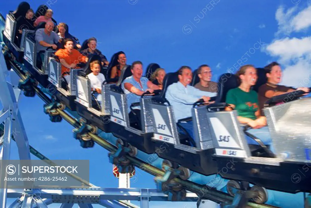 People flying around on roller coaster