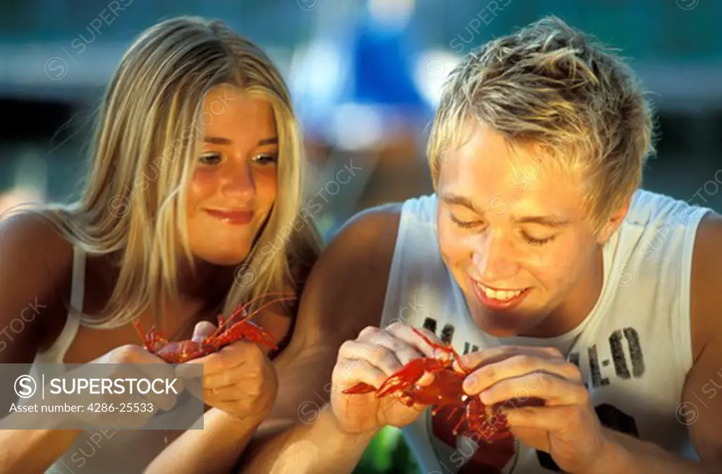 Young Swedes eating crayfish in August