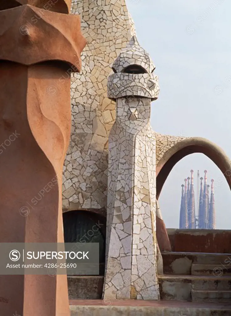Casa Mil or La Pedrera with Sagrada Familia beyond in Barcelona 