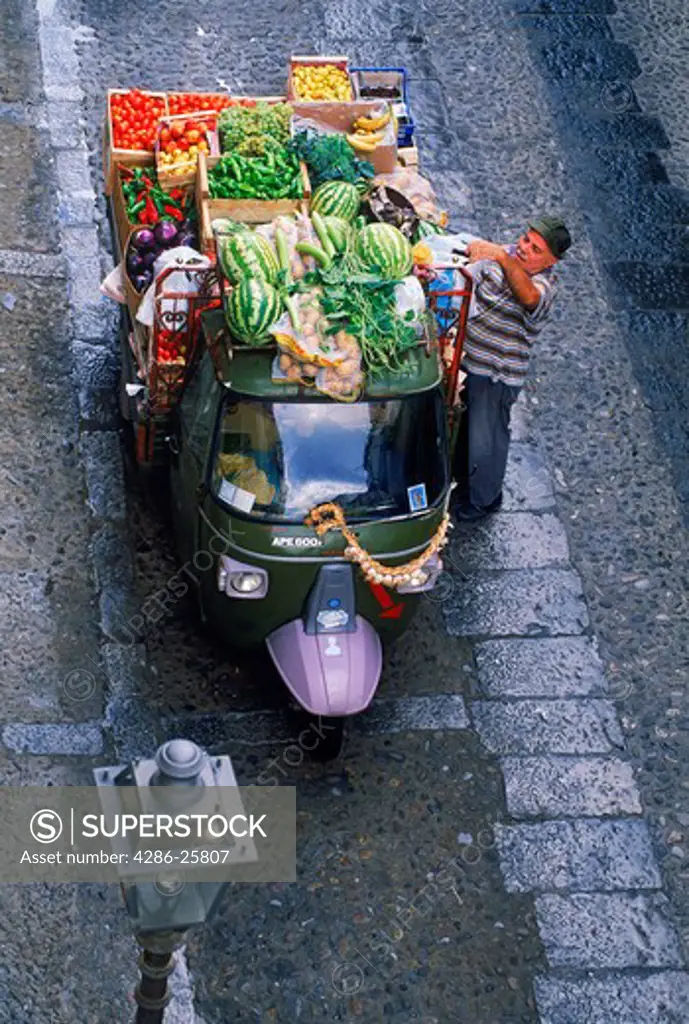 Vegetable delivery truck on village streets of Cefalu in Sicily 
