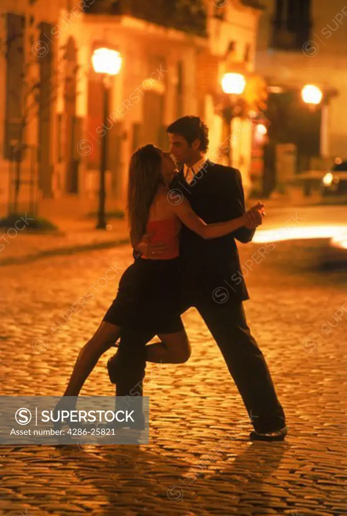 Couple tango dancing on streets of San Telmo in Buenos Aires