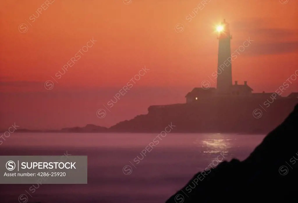 Pigeon Point Lighthouse in California at dusk